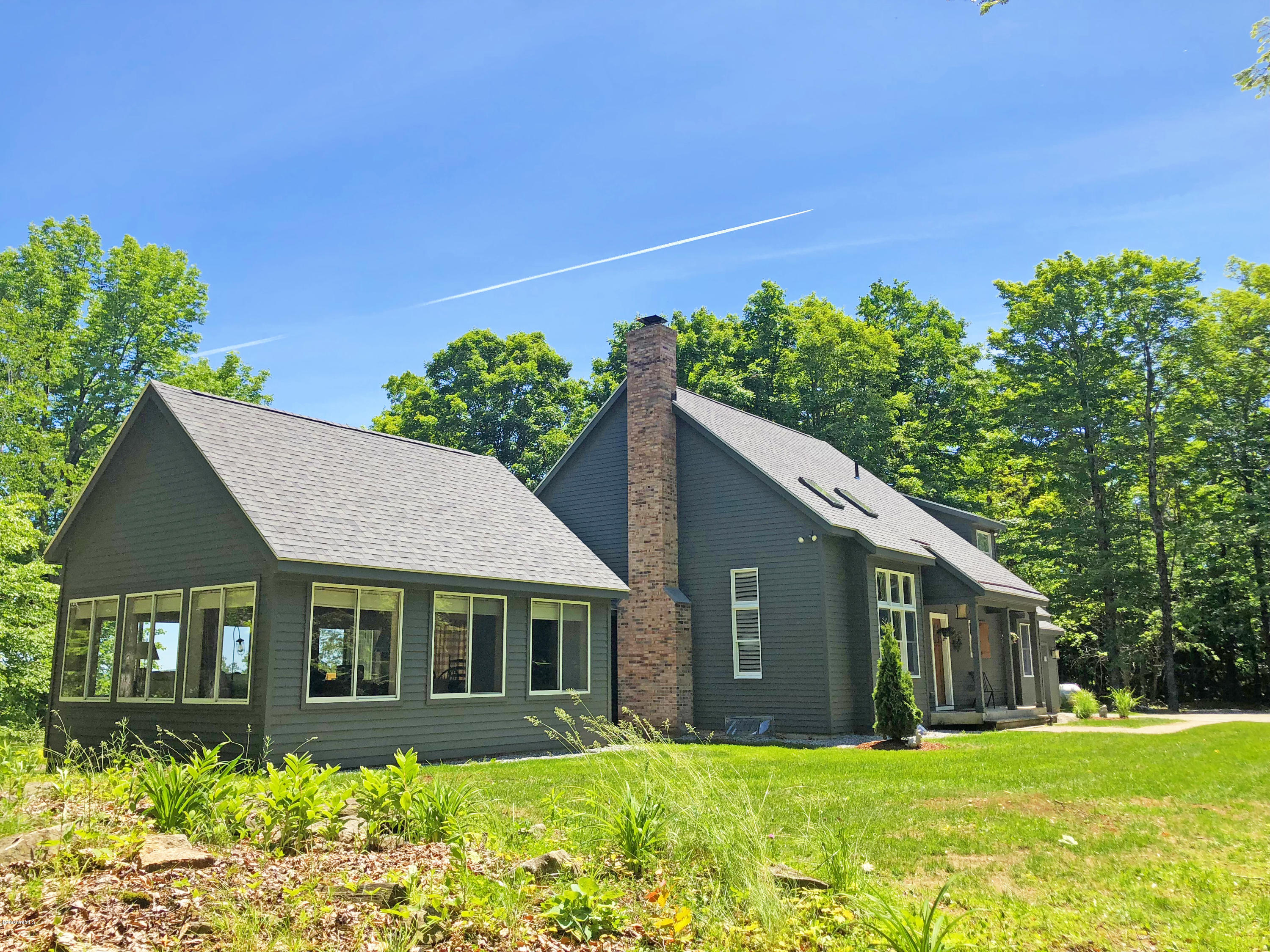 263 Harrington Road Otis, MA 01253 - Photo 7 of 33 a front view of a house with a yard