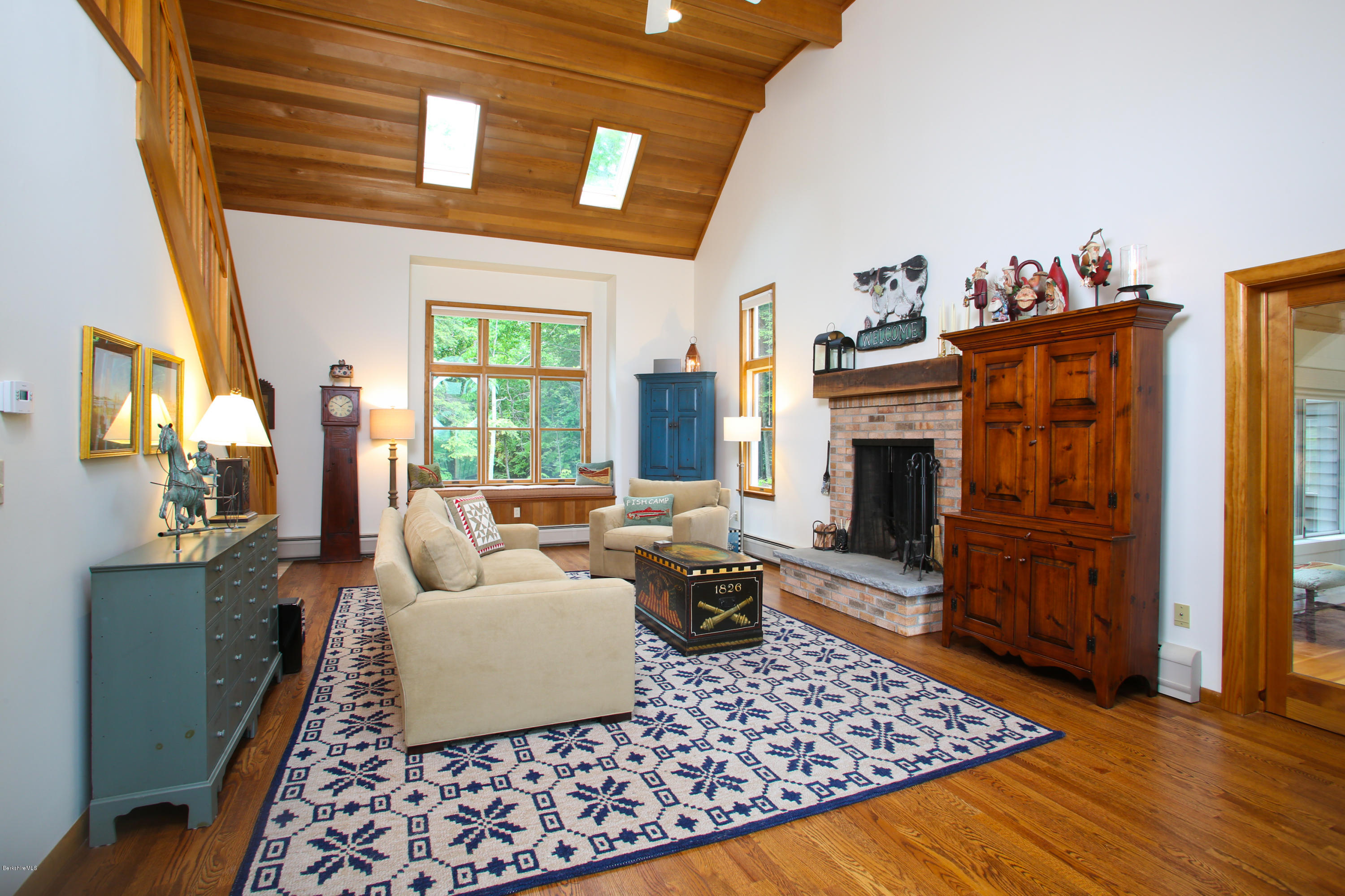263 Harrington Road Otis, MA 01253 - Photo 10 of 33 a living room with furniture and a fireplace