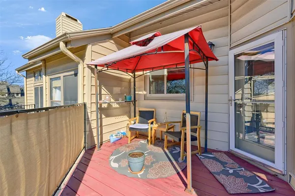 a bathroom with a granite countertop toilet sink and mirror