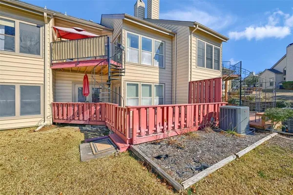 a view of a backyard with a large tree