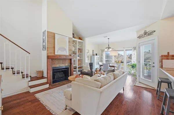 a living room with furniture fireplace and flat screen tv