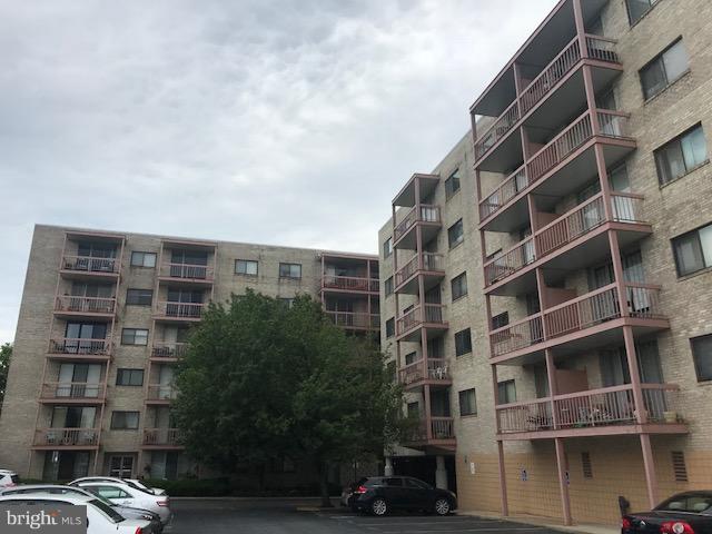 130 Slade Avenue, Unit 411 Baltimore, MD 21208 - Photo 1 of 18 a front view of a building