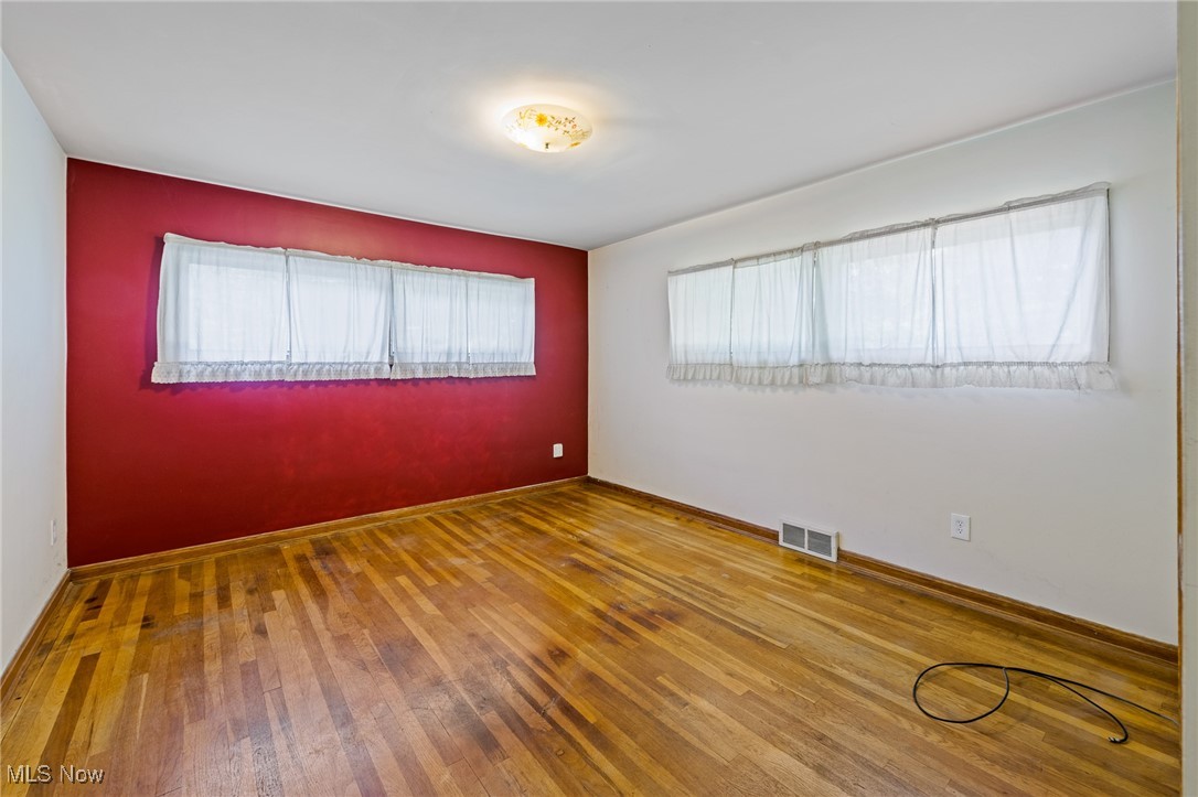 718 Fairwood Road Akron, OH 44319 - Photo 7 of 15 Unfurnished room with hardwood / wood-style flooring