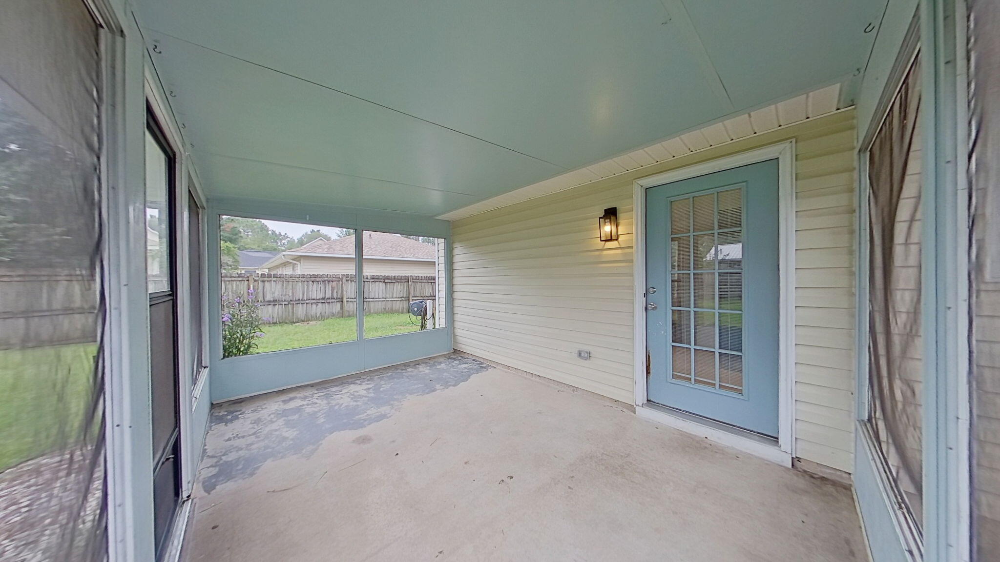 212 Water Oak Lane Crestview, FL 32539 - Photo 14 of 29 a view of an empty room with glass door and porch