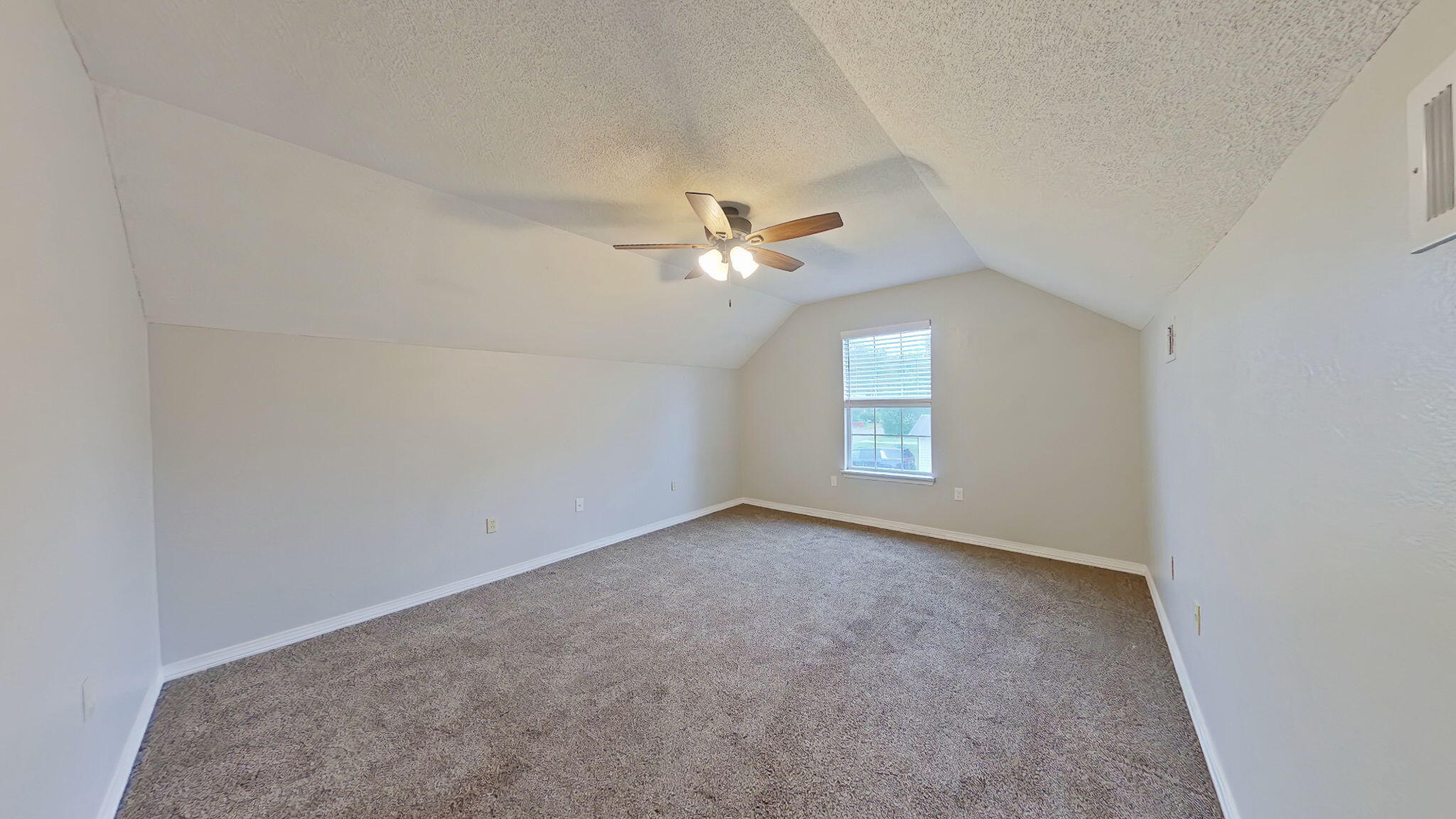 212 Water Oak Lane Crestview, FL 32539 - Photo 16 of 29 an empty room with a window and a ceiling fan