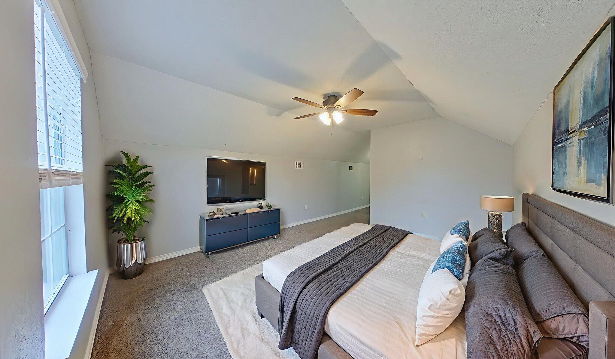 212 Water Oak Lane Crestview, FL 32539 - Photo 19 of 29 a bedroom with a bed and a television