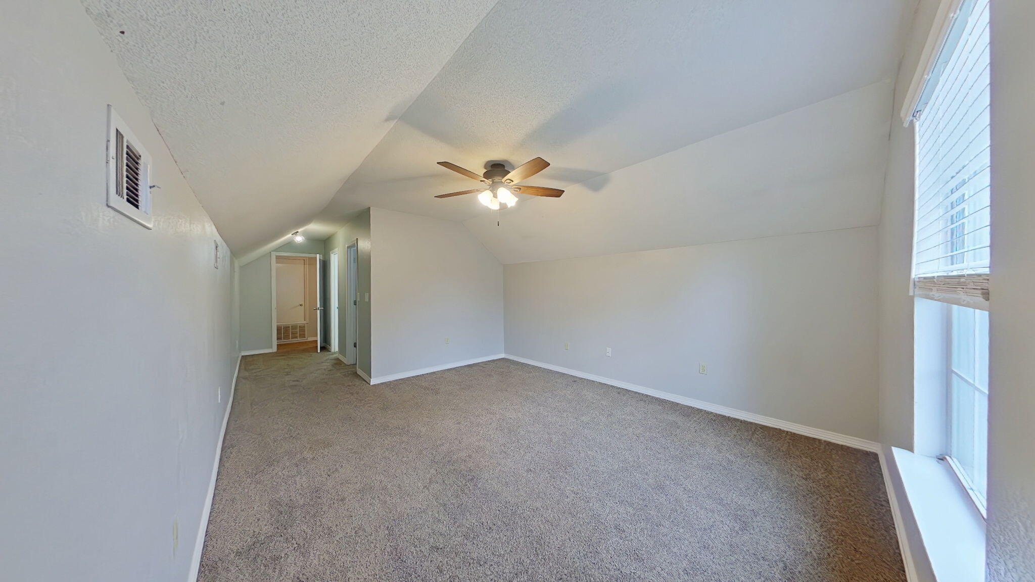 212 Water Oak Lane Crestview, FL 32539 - Photo 20 of 29 wooden floor in an empty room with a window