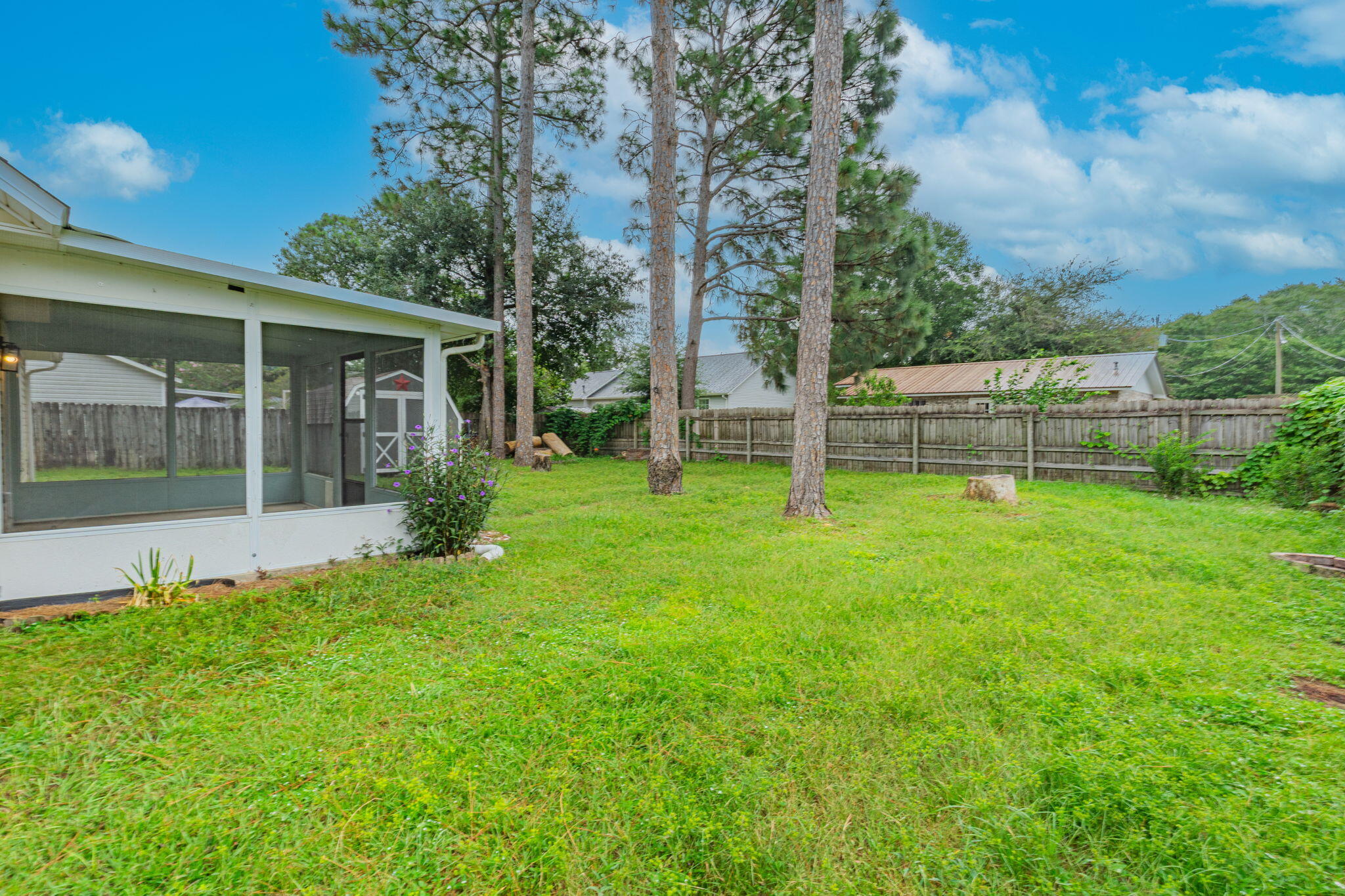 212 Water Oak Lane Crestview, FL 32539 - Photo 27 of 29 a view of a house with backyard and a tree