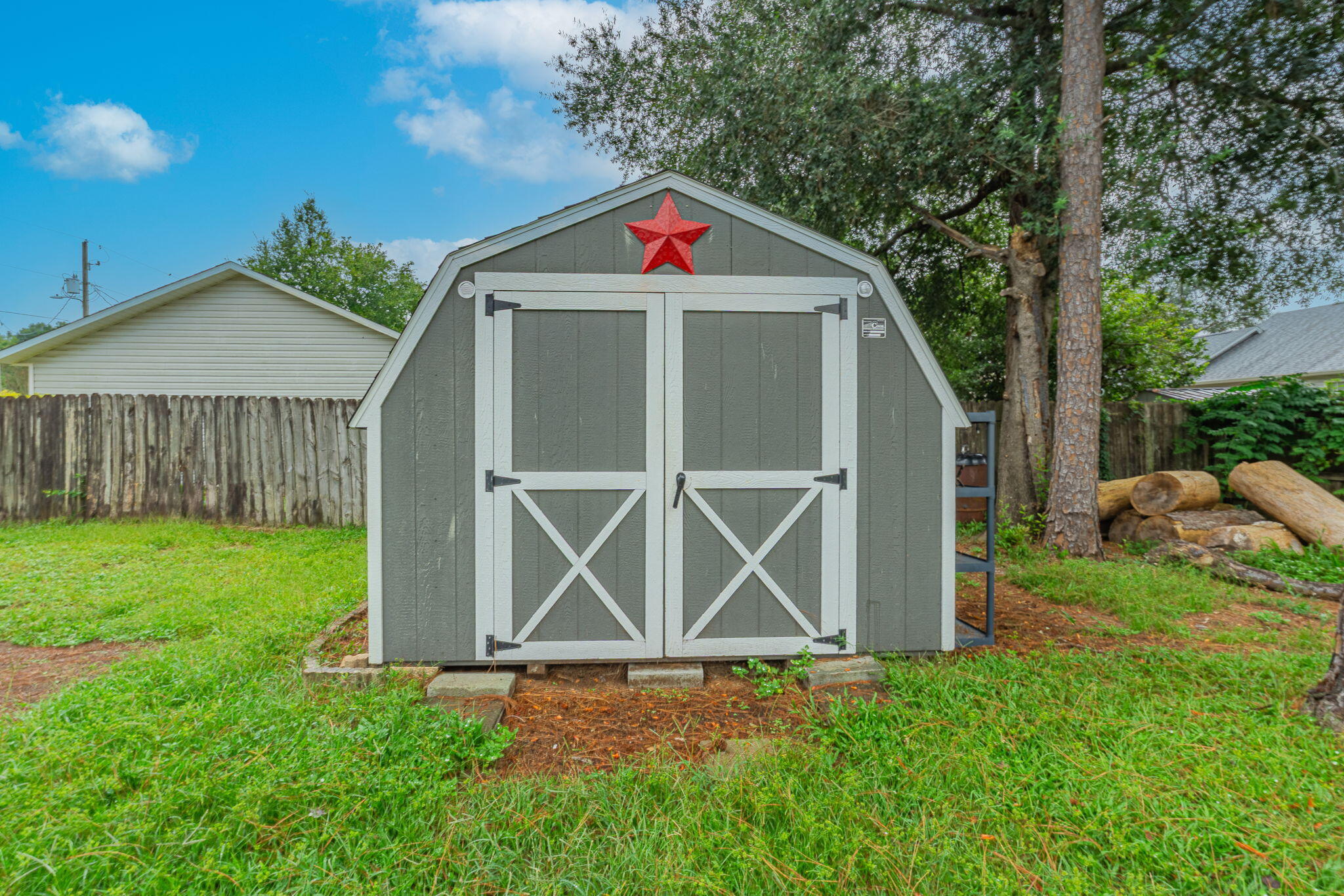 212 Water Oak Lane Crestview, FL 32539 - Photo 28 of 29 a house with green field in front of it
