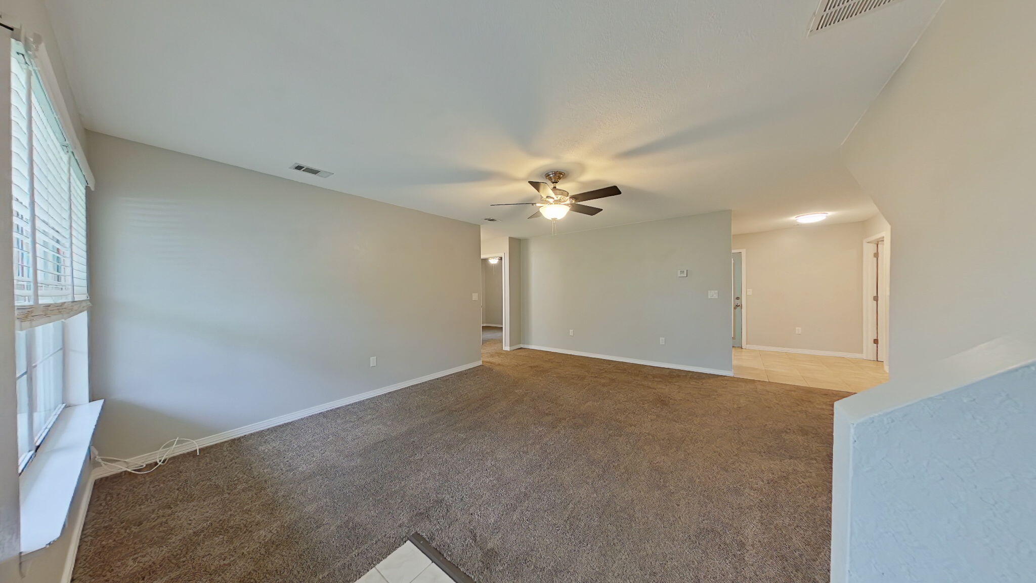 212 Water Oak Lane Crestview, FL 32539 - Photo 4 of 29 a view of an empty room with a window