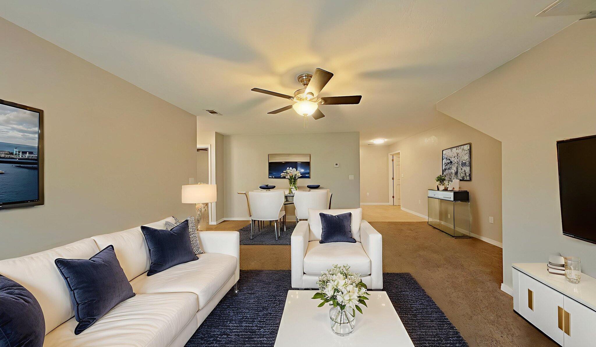 212 Water Oak Lane Crestview, FL 32539 - Photo 6 of 29 a living room with furniture a flat screen tv and a fireplace