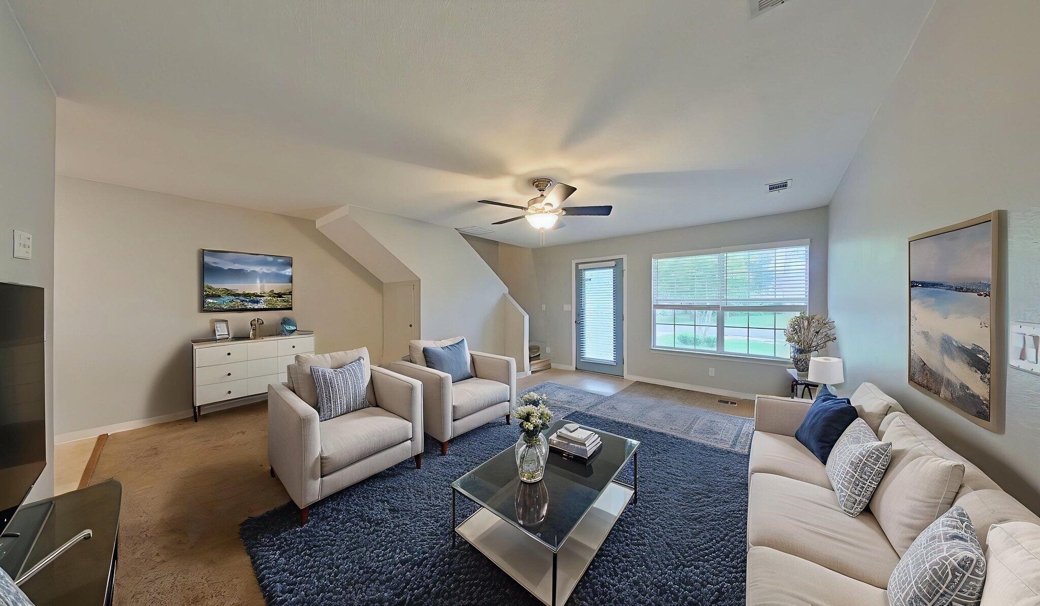 212 Water Oak Lane Crestview, FL 32539 - Photo 8 of 29 a living room with furniture and a flat screen tv