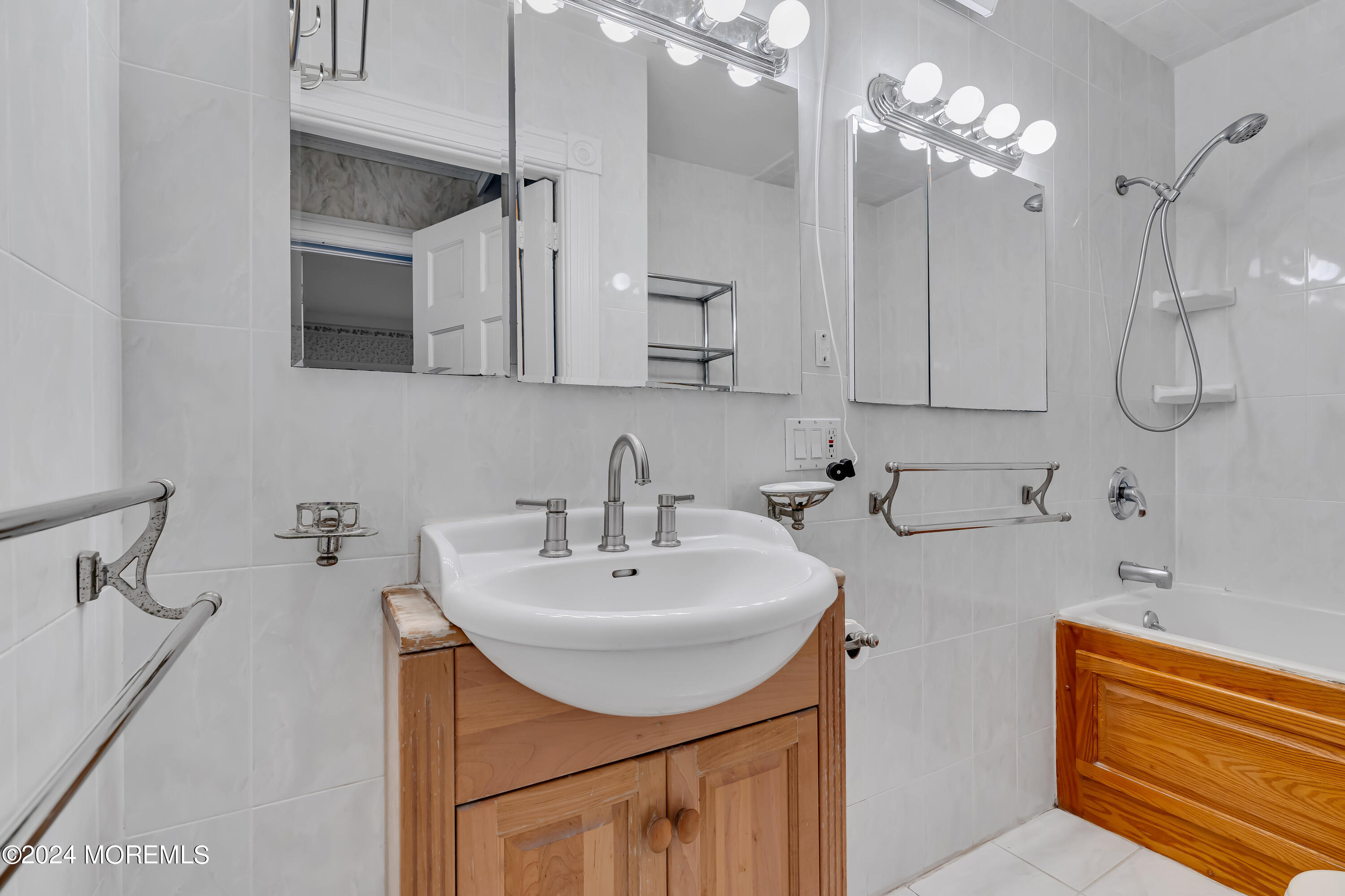45 2nd Street Keyport, NJ 07735 - Photo 18 of 24 a bathroom with a sink double vanity and a mirror