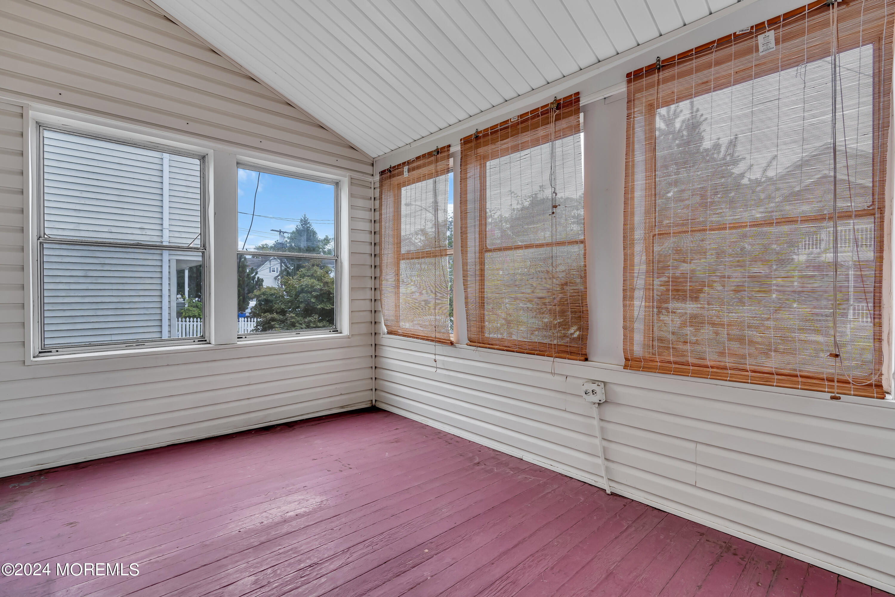 45 2nd Street Keyport, NJ 07735 - Photo 2 of 24 a view of an empty room with wooden floor and a window