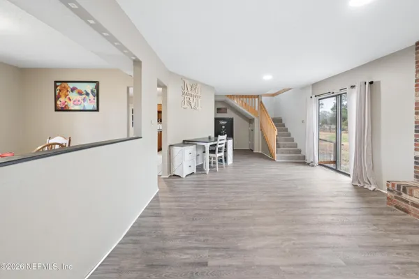 a view of a livingroom with wooden floor