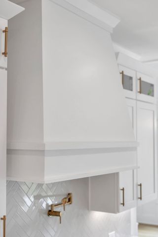 a kitchen with stainless steel appliances granite countertop a stove and a sink