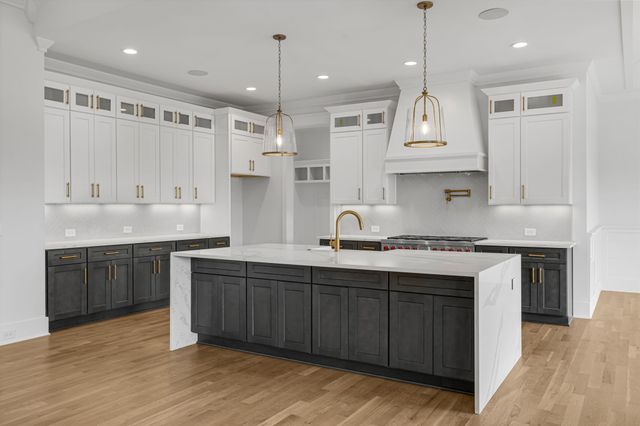 a white stove top oven sitting inside of a kitchen