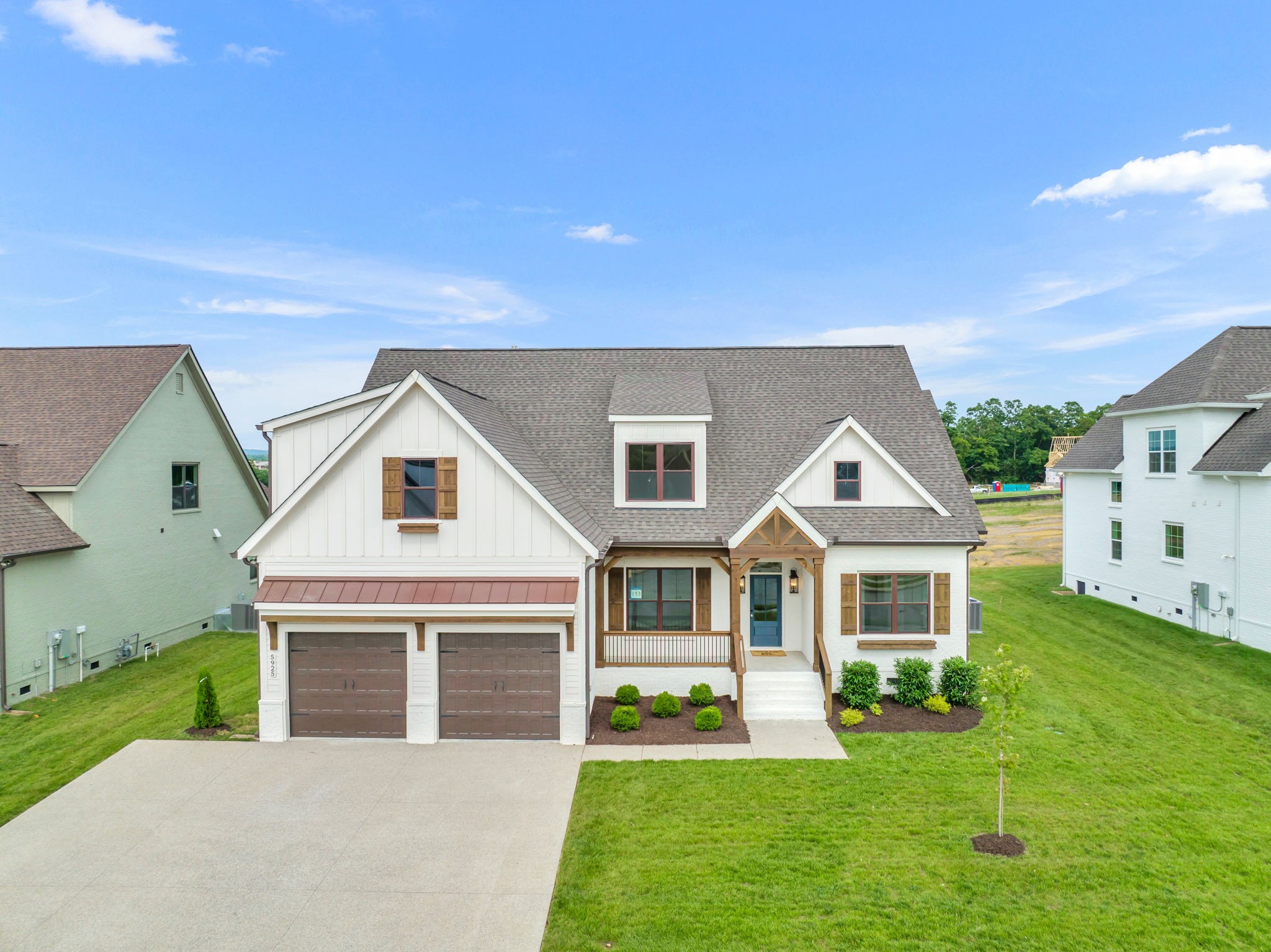 5925 Hunt Valley Drive Spring Hill, TN 37174 - Photo 2 of 69 a front view of a house with a yard and garage
