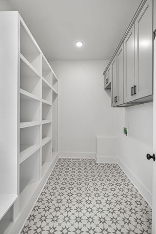 a bathroom with a tub sink shower and mirror