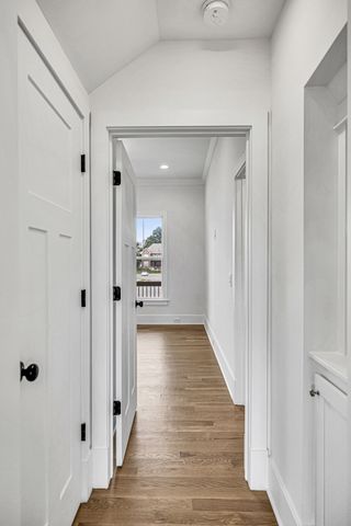 a view of a bathroom with wooden floor
