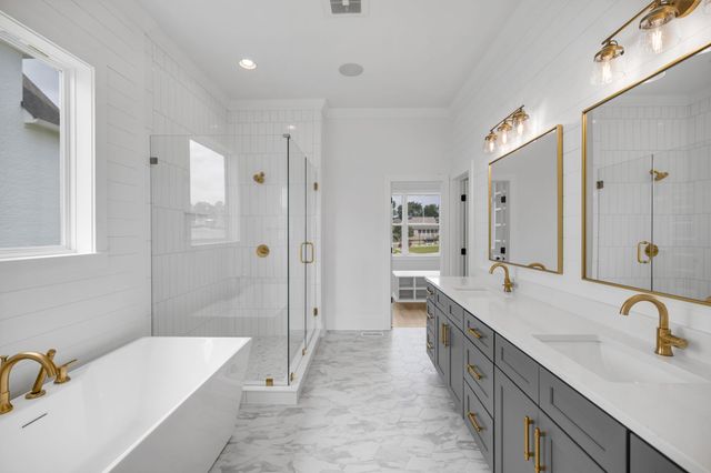 an empty room with cabinet and windows