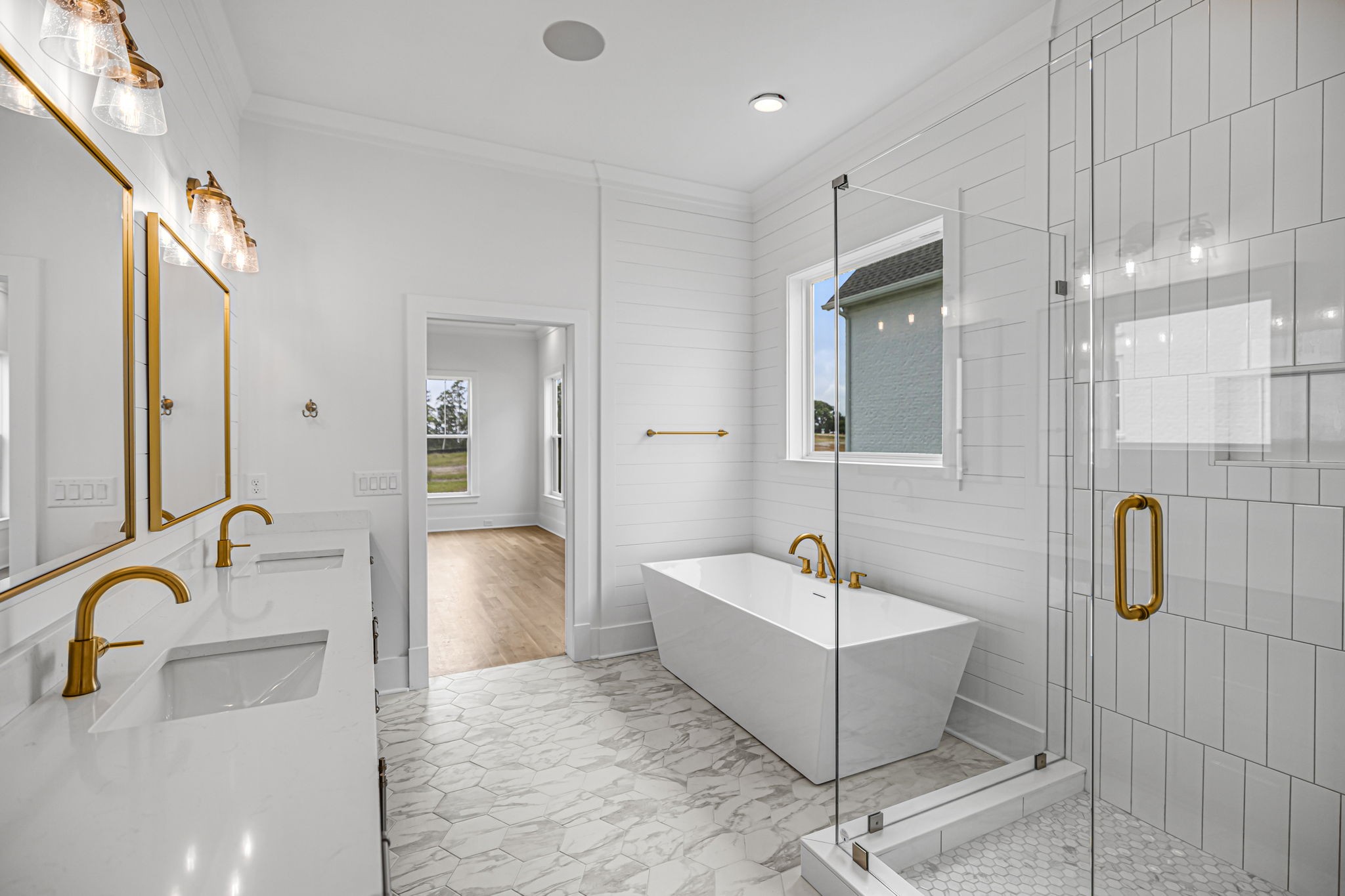 5925 Hunt Valley Drive Spring Hill, TN 37174 - Photo 42 of 69 a bathroom with a tub sink shower and mirror