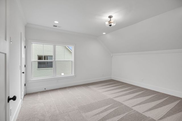 a view of a brick house with a street