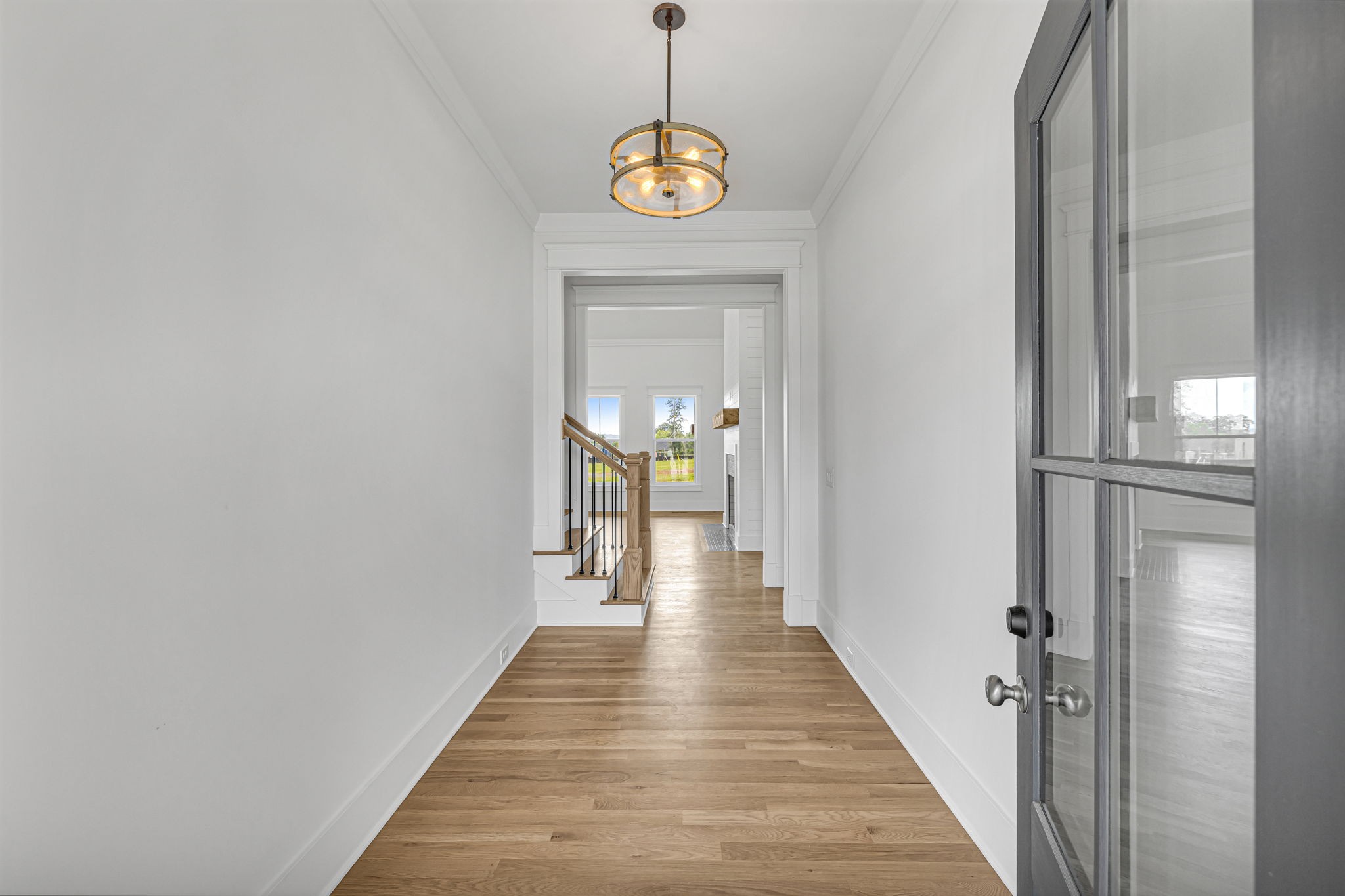 5925 Hunt Valley Drive Spring Hill, TN 37174 - Photo 5 of 69 a view of a hallway with wooden floor and staircase