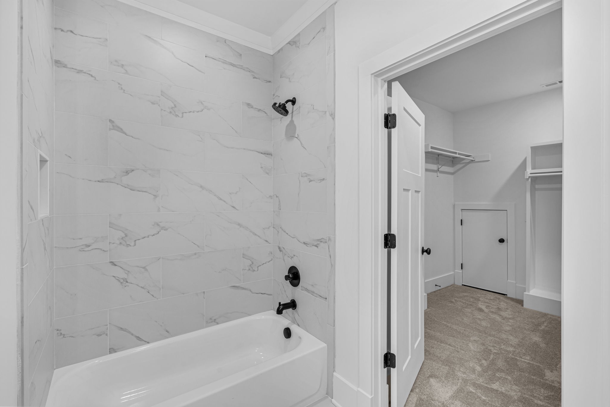 5925 Hunt Valley Drive Spring Hill, TN 37174 - Photo 59 of 69 a bathroom with a bathtub and a shower