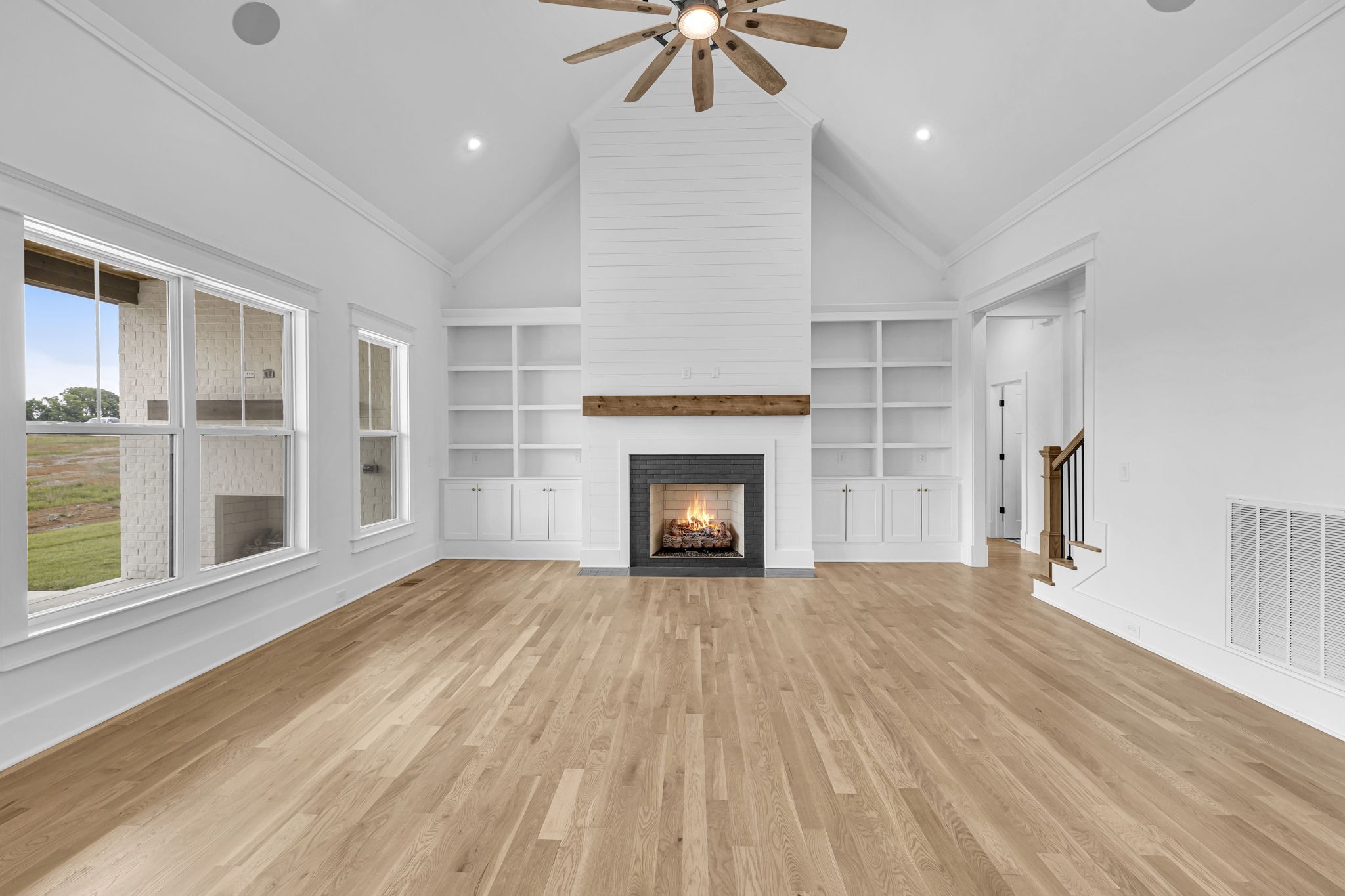 5925 Hunt Valley Drive Spring Hill, TN 37174 - Photo 7 of 69 a view of an empty room with a fireplace and a window