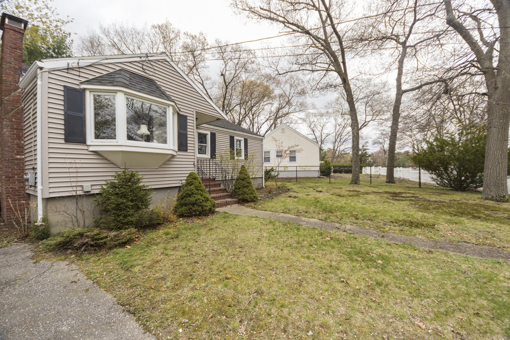 85 Russ Street Randolph, MA 02368 - Photo 2 of 16 a view of a yard with a large tree