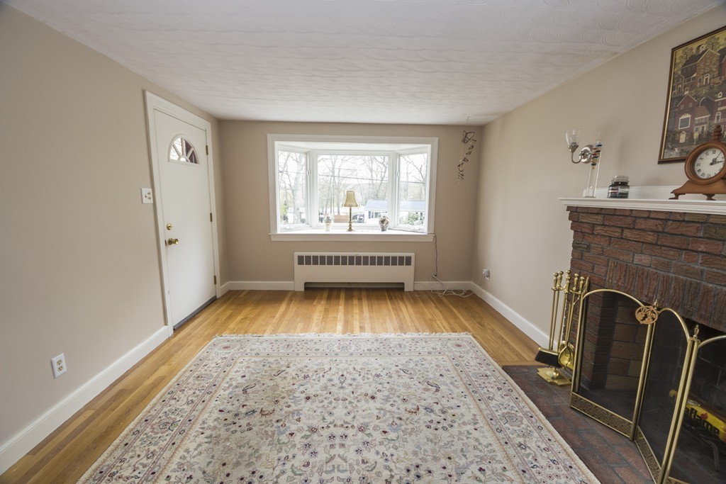 85 Russ Street Randolph, MA 02368 - Photo 4 of 16 a view of empty room with fireplace and window