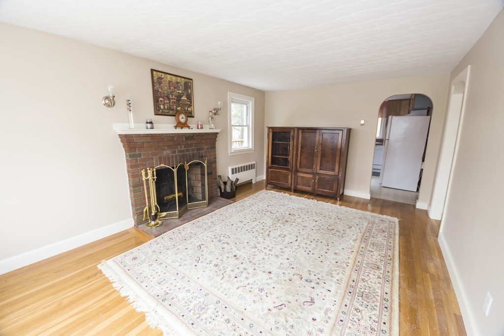 85 Russ Street Randolph, MA 02368 - Photo 5 of 16 a view of livingroom with furniture and a fireplace