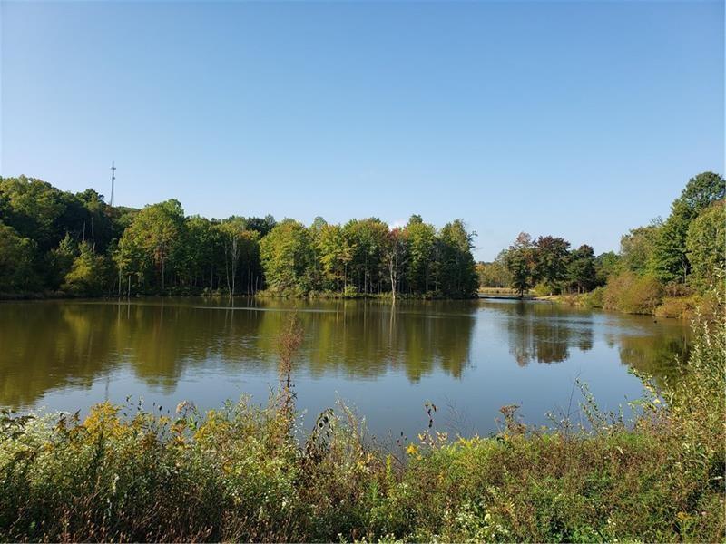 Lot 52 Cambridge Way New Castle, PA 16101 - Photo 8 of 9 a view of a lake with a city view