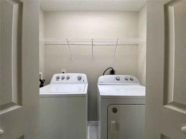a utility room with dryer and washer