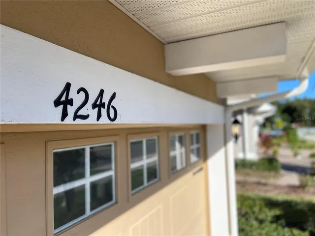 a view of a hallway with windows