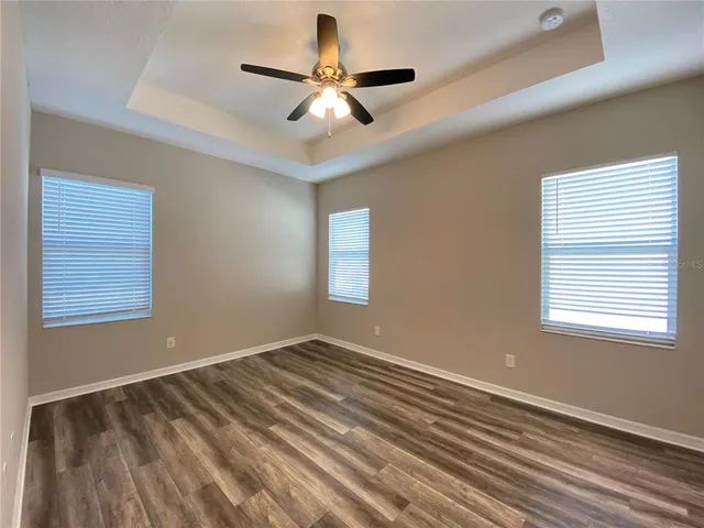 a view of room with window and ceiling fan