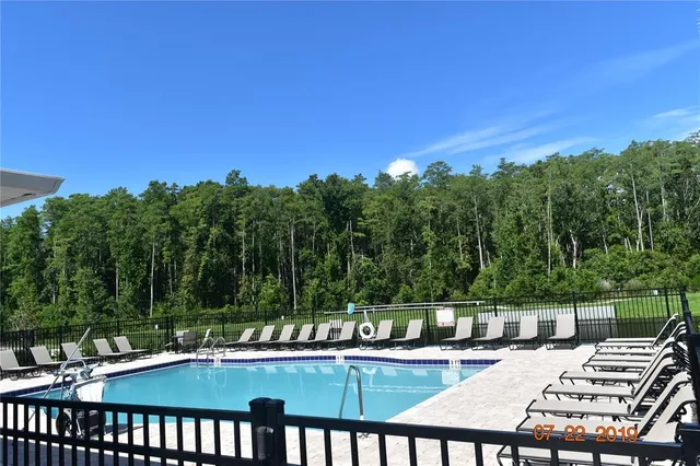 a view of a swimming pool with a patio