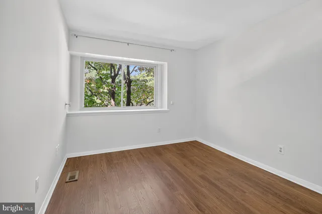 a living room with fireplace furniture and a flat screen tv