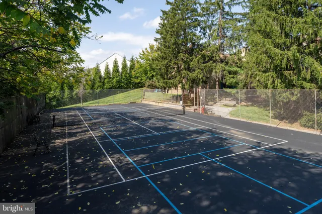 a view of a house with swimming pool and a yard