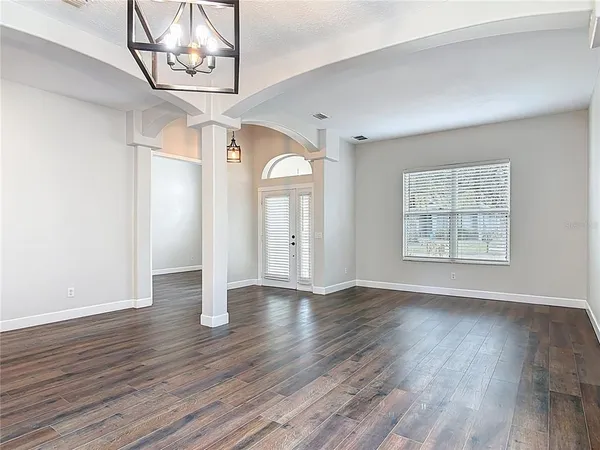 a kitchen with white cabinets appliances and a sink