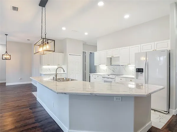 an empty room with wooden floor