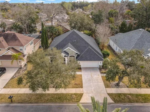 an empty room with wooden floor and a window