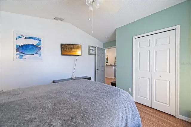 a bedroom with bed and a window