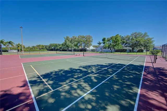 a view of an outdoor space and tennis court