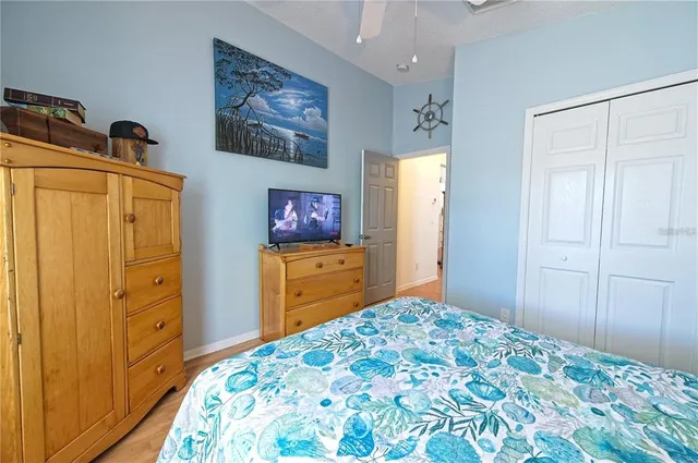 a bedroom with a bed and a dresser in it