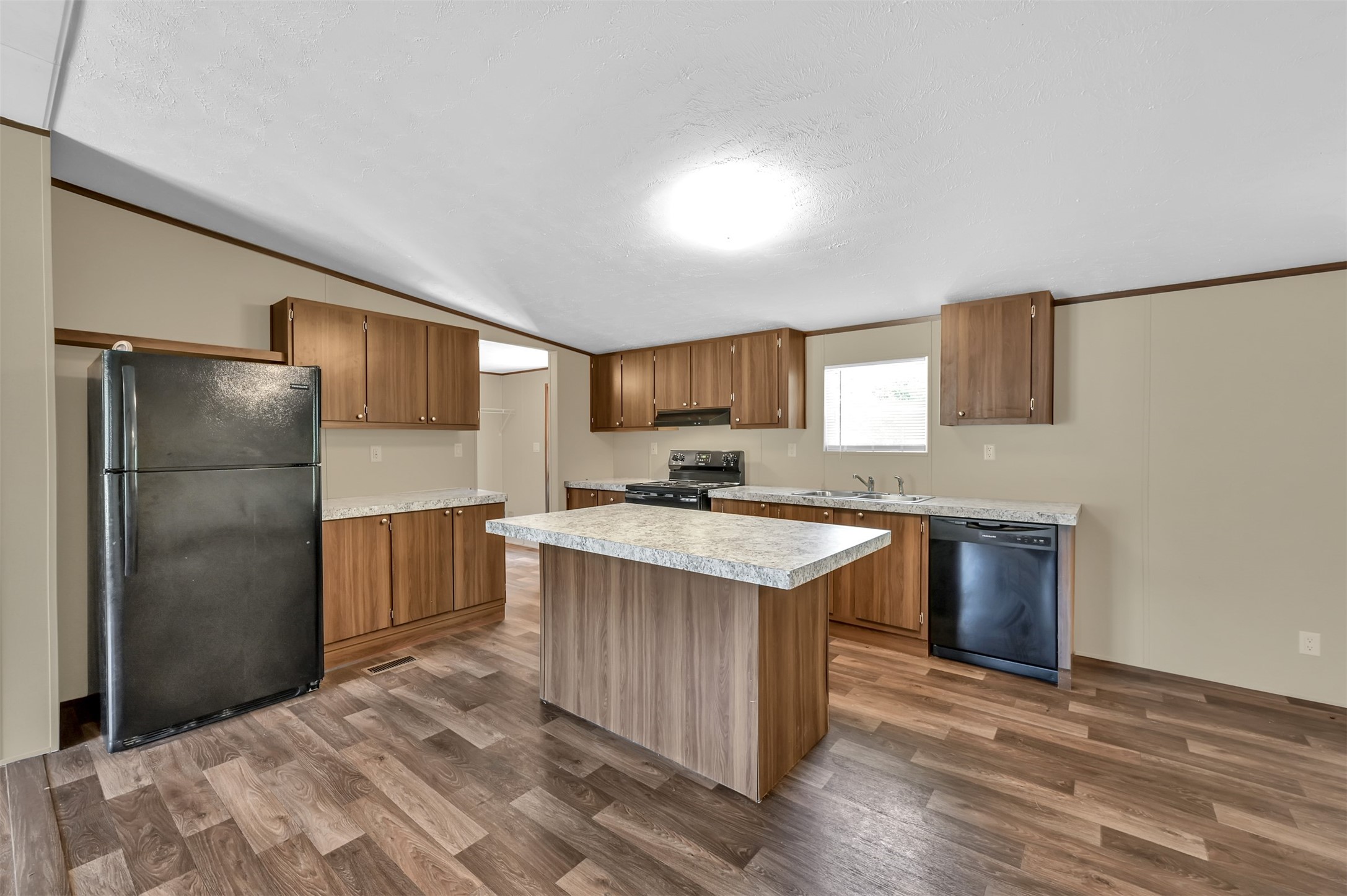 26768 A Dobbin-Huffsmith Road Magnolia, TX 77354 - Photo 12 of 29 a kitchen with a refrigerator sink and stove