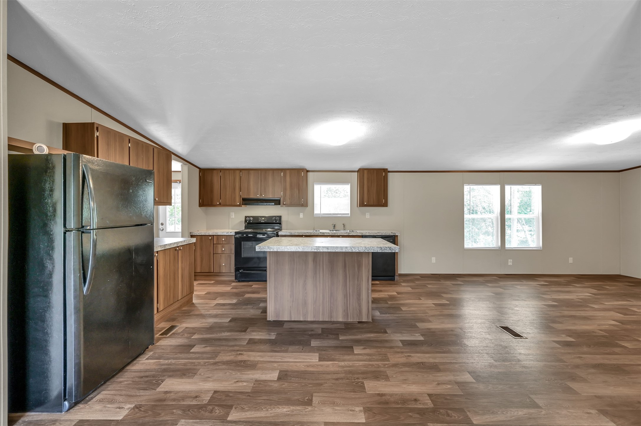 26768 A Dobbin-Huffsmith Road Magnolia, TX 77354 - Photo 13 of 29 a kitchen with a refrigerator sink and cabinets
