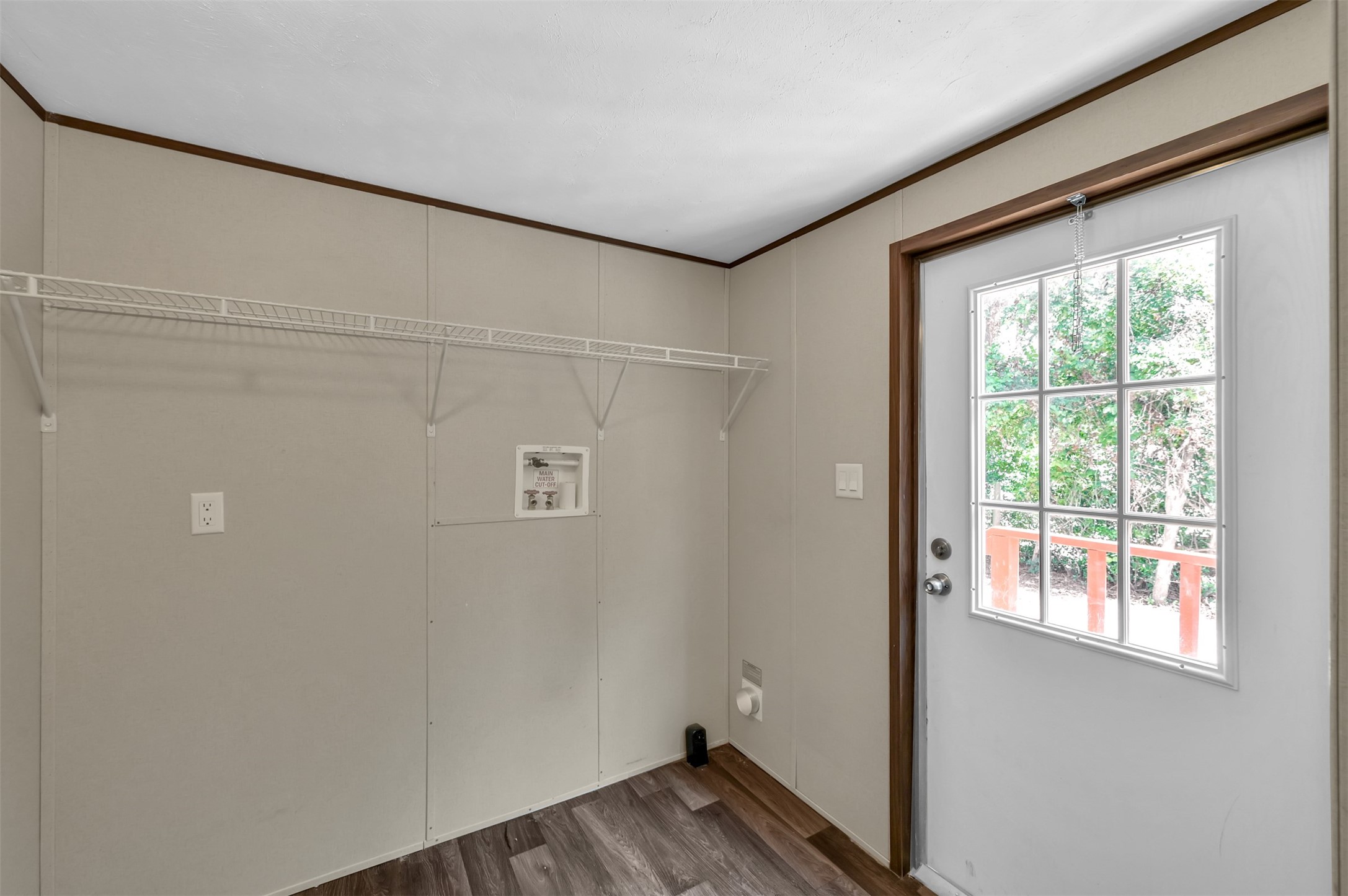 26768 A Dobbin-Huffsmith Road Magnolia, TX 77354 - Photo 15 of 29 a view of an empty room with wooden floor and a window