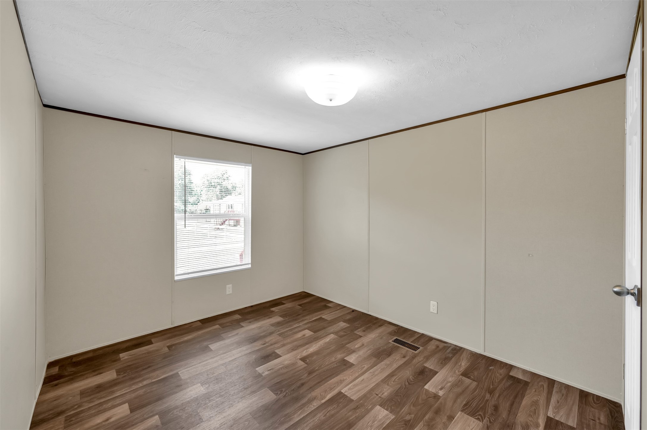 26768 A Dobbin-Huffsmith Road Magnolia, TX 77354 - Photo 20 of 29 an empty room with wooden floor and windows